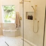 white bathtub with shower curtain