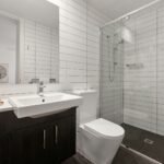 white ceramic sink with stainless steel faucet
